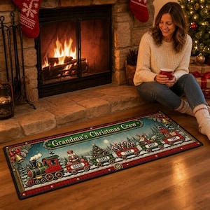 May include: A rectangular Christmas-themed floor mat featuring a vintage train illustration with the text Grandma's Christmas Crew. The train cars are decorated with a nutcracker, a Christmas tree, candy canes, and a reindeer, each labelled with names.