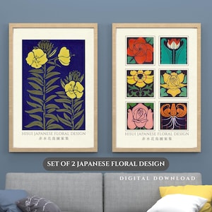 May include: Set of two framed prints featuring Japanese floral designs. One print showcases yellow flowers on a dark blue background. The other displays six floral illustrations in various colors. Text includes "HISUI JAPANESE FLORAL DESIGN" and "SET OF 2 JAPANESE FLORAL DESIGN."