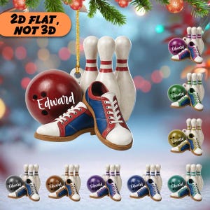 May include: A 2D flat bowling-themed ornament featuring a red bowling ball with the name Edward printed in white, paired with a pair of white, red, and blue bowling shoes and three white bowling pins with red stripes, hanging from a gold cord.