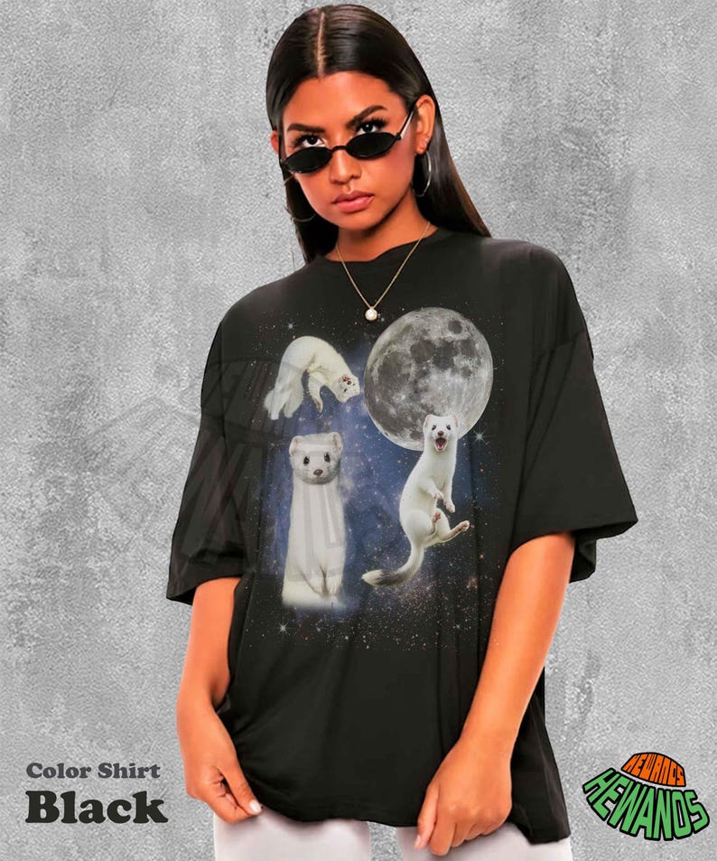 May include: Black t-shirt featuring a graphic of white ferrets against a starry background and a full moon. The shirt has the text "Color Shirt Black" at the bottom left.