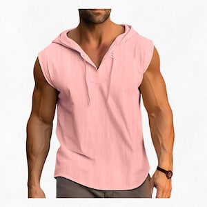 May include: A sleeveless, light pink hooded shirt with a V-neckline and drawstring. The shirt has a button closure at the neckline. The fabric appears to be a lightweight material, suitable for warm weather. The shirt is a solid color.