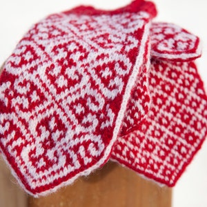 Close up of red and white colorwork mittens