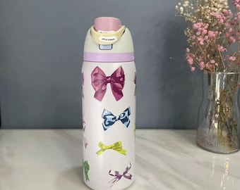 Botella de agua OWALA de 946 ml con sistema FreeSip, diseño de lazos femeninos, botella estética con lazo coqueto, color rosa, ideal para hidratación. Regalo perfecto para ella.