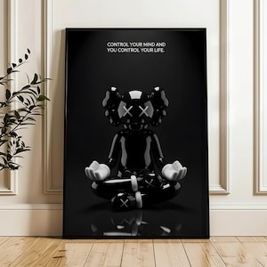 Puede incluir: Impresi&oacute;n art&iacute;stica enmarcada en negro que presenta una figura negra brillante en posici&oacute;n meditativa con manos blancas y ojos tachados. La obra de arte incluye el texto "CONTROL YOUR MIND AND YOU CONTROL YOUR LIFE."