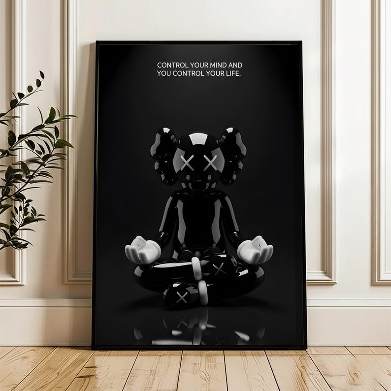 Puede incluir: Impresi&oacute;n art&iacute;stica enmarcada en negro que presenta una figura negra brillante en posici&oacute;n meditativa con manos blancas y ojos tachados. La obra de arte incluye el texto "CONTROL YOUR MIND AND YOU CONTROL YOUR LIFE."