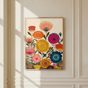 May include: A framed art print featuring a colorful floral design. The artwork showcases a variety of stylized flowers in shades of pink, orange, yellow, and blue against a cream background. The print is encased in a light brown wooden frame.