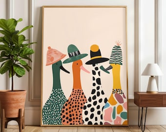 May include: A framed art print featuring four whimsical bird figures, each adorned with a unique hat. The birds have patterned bodies in green, orange, and black, set against a soft beige background. The artwork is displayed in a room with a plant and a lamp.