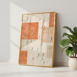 May include: A framed abstract art print featuring a geometric design with orange and beige blocks. Tiny figures are scattered across the blocks, creating a sense of depth. The gold frame adds a touch of elegance to the artwork.
