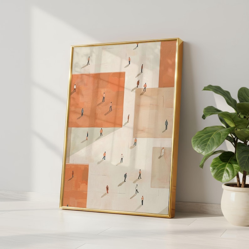 May include: A framed abstract art print featuring a geometric design with orange and beige blocks. Tiny figures are scattered across the blocks, creating a sense of depth. The gold frame adds a touch of elegance to the artwork.