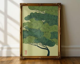 May include: A framed wall art print featuring a stylized tree with layered, swirling green foliage in varying shades of dark and light green. The tree has a dark, curved trunk and a small red square stamp in the lower left corner of the print.