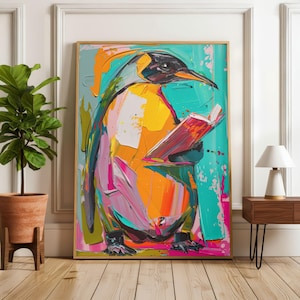 May include: An abstract painting of a penguin reading a book. The artwork uses bold brushstrokes in yellow, orange, pink, teal, and black. The penguin is the focal point, holding a red book. The painting is framed.