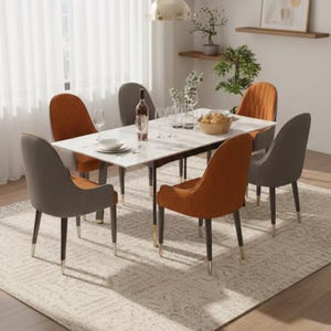 May include: A contemporary dining set featuring a white rectangular table and six upholstered chairs. The chairs are a mix of orange and grey, with dark wooden legs and gold accents. A rug and decorative items complete the scene.