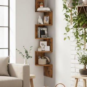May include: A wooden corner shelf unit with a zigzag design. The shelves display books, plants, and ornaments. The unit is made of dark wood with a natural grain. The shelves are mounted on a white wall in a living room setting, with a copper watering can.
