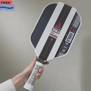 May include: A white ceramic mug with a black handle and the text "But First, Coffee" in a handwritten style. The mug is on a white surface. The mug is approximately 4 inches tall.