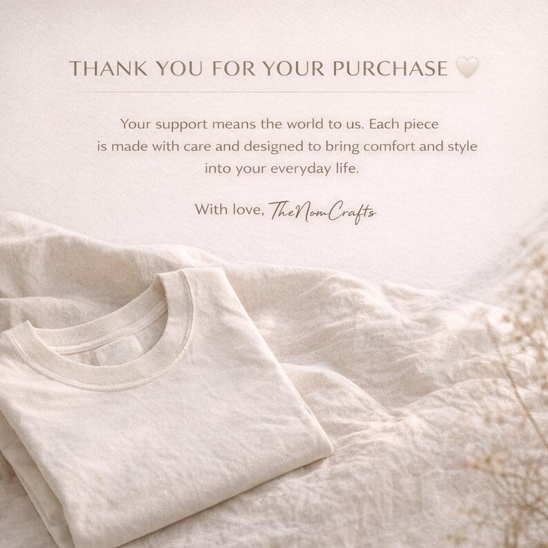 May include: A cream-colored t-shirt is neatly folded on a textured, off-white fabric. The image includes text that reads "THANK YOU FOR YOUR PURCHASE" and a message about comfort and style. The brand name "The Nom Crafts" is also visible.