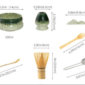May include: A matcha tea set including a green speckled ceramic bowl with a 5.51 inch diameter, a 2.75 inch tall whisk holder, a 3.86 inch wide mountain-shaped rest, a 6.29 inch wooden spoon, a 7.17 inch bamboo scoop, a 4 inch whisk, and a 8.07 inch strainer.