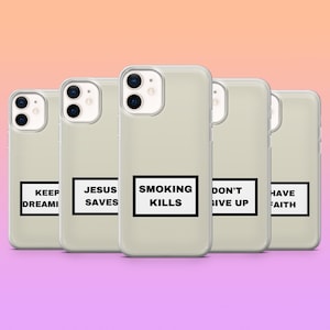 May include: Several clear phone cases, each displaying a different black text phrase on a white rectangle. The phrases read: "KEEP DREAMI", "JESUS SAVES", "SMOKING KILLS", "DON'T GIVE UP", and "HAVE FAITH". The background is a gradient of pink and purple.