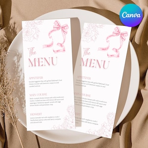 May include: Two white menu cards with pink text and floral accents. The cards feature a pink bow and the words "The MENU". The menu lists appetizers, main courses, and desserts. The Canva logo is visible in the upper right corner.