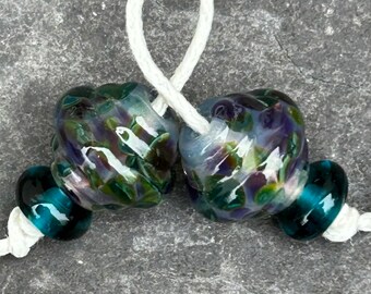 Joker ornate lampwork glass bead pair