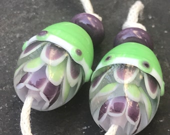 Purple Green Lotus Egg lampwork glass bead pair