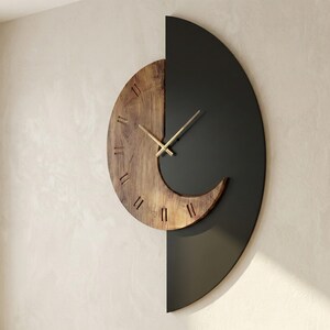 Modern half moon wall clock with natural wood and matte black finish, minimalist artistic wall clock design