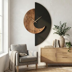 May include: A modern wall clock with a unique design. The clock features a half-circle shape with a wooden face and a black background. The clock hands are gold, and the clock is mounted on a white wall. The clock is part of a home decor theme.