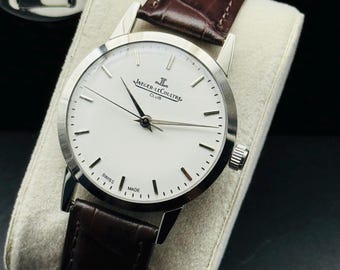 Relógio Jaeger-LeCoultre Club vintage: fabricado na Suíça, corda manual, mostrador branco clássico JLC.