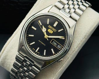 Reloj de pulsera automático vintage Seiko 5 para hombre, día y fecha, esfera negra, referencia 7S26