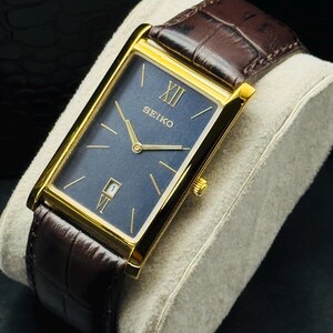 Rare Vintage Seiko Slim Gold Rectangular Seiko wrist watch Brown leather strap Blue Face