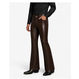 May include: Brown, flared trousers with a textured, snakeskin-like pattern. The trousers have a high waist and are paired with black dress shoes. The model is wearing a black button-down shirt.