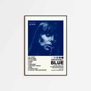 May include: A framed poster featuring the album "Blue" by Joni Mitchell. The poster has a blue and white color scheme, with a portrait of Mitchell and the album's tracklist. The album title and artist's name are prominently displayed.