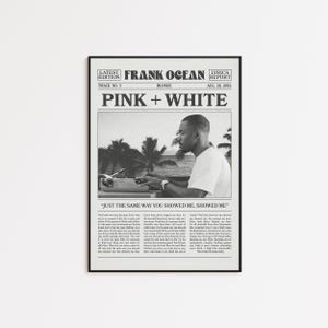 May include: Black framed print featuring a newspaper-style design with the headline "PINK + WHITE" and the artist's name "FRANK OCEAN." The image includes a black and white photo of a person and lyrics from the song. The text "JUST THE SAME WAY YOU SHOWED ME, SHOWED ME" is also visible.