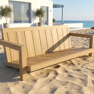 May include: A light brown wooden bench featuring a slatted backrest and a flat seat with two armrests. The bench is constructed from vertical and horizontal wooden planks, showcasing a natural wood grain texture and a clean, linear design.