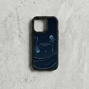 May include: Black phone case with a dark blue night sky design, two whale sharks, and the quote, "Luck is what happens when preparation meets opportunity." The case has a black border and a glossy finish.