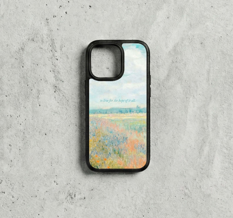 May include: Black phone case with a landscape painting of a field of flowers under a blue sky. The text "to live for the hope of it all" is printed on the case.