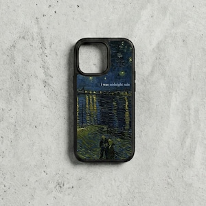 May include: Black phone case with a starry night design, river, and figures in the style of Van Gogh. The text "i was midnight rain" is printed on the case. The case has a black border.