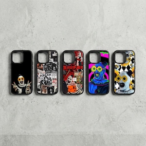 May include: Five black phone cases with unique designs. The cases feature various horror-themed graphics, including a clown with sunflower eyes, movie posters, and a clown with a black and white diamond pattern. The cases are arranged in a row against a gray background.