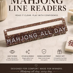 May include: A rectangular mahjong line reader featuring a brown glitter finish and the white text MAHJONG ALL DAY. The product is displayed alongside promotional text including ELEVATE EVERY GAME, READ IT CLEAR, PLAY WITH CONFIDENCE, and various icons.