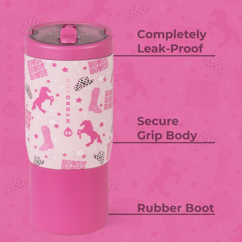 May include: A pink Hydrojug water bottle with a white band featuring pink cowboy boots, horses, and hearts. The bottle has a pink lid and base, and the text "Howdy" is repeated on the band. The bottle is designed to be leak-proof.