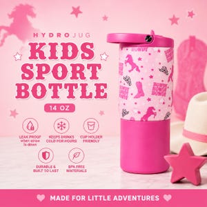 May include: Pink Hydro Jug kids sport bottle with a cowboy theme. The bottle has a pink lid and base, with a white center patterned with pink horses, stars, and cowboy boots. The text "KIDS SPORT BOTTLE" is displayed in pink. It holds 14 oz.