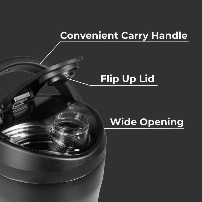 May include: Close-up of a black water bottle with a convenient carry handle and a flip-up lid. The bottle has a wide opening for easy filling and cleaning. The image highlights the bottle's features against a dark background.