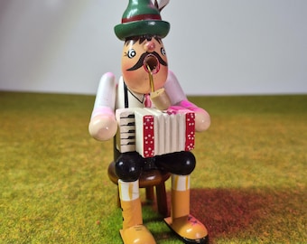 Smoking Man 'Quetschkommodenspieler' accordéoniste fumeur d'encens allemand