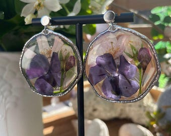 Earrings composed of real spring flowers in resin