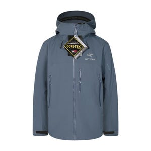 May include: A slate blue Arc'teryx jacket with a hood and a full-length zipper. The jacket features the Gore-Tex logo and the Arc'teryx logo. It has two zippered pockets on the front and a small logo on the sleeve.