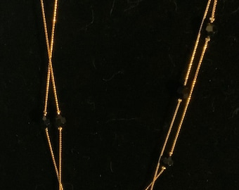 Gold tone black Swarovski crystal necklace and bracelet