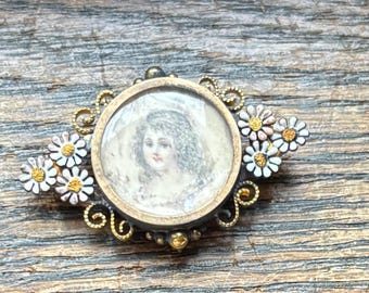 Painted miniature portrait of lady with movable enamel flowers in gold filled frame. 1880