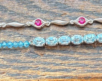 Sterling silver ruby and topaz bracelets