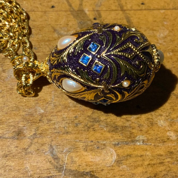 Black enamel and gold faux pearl and blue rhinestones faberge egg necklace