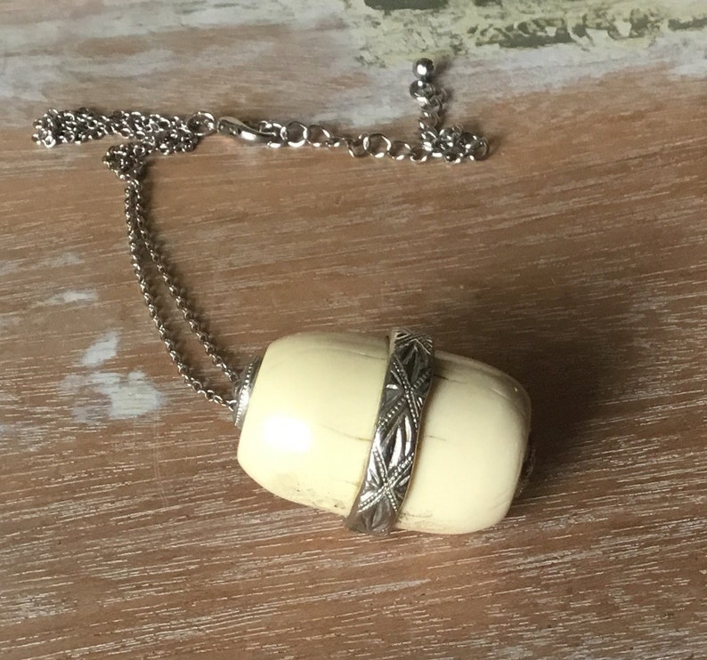Asian bone pendant necklace.