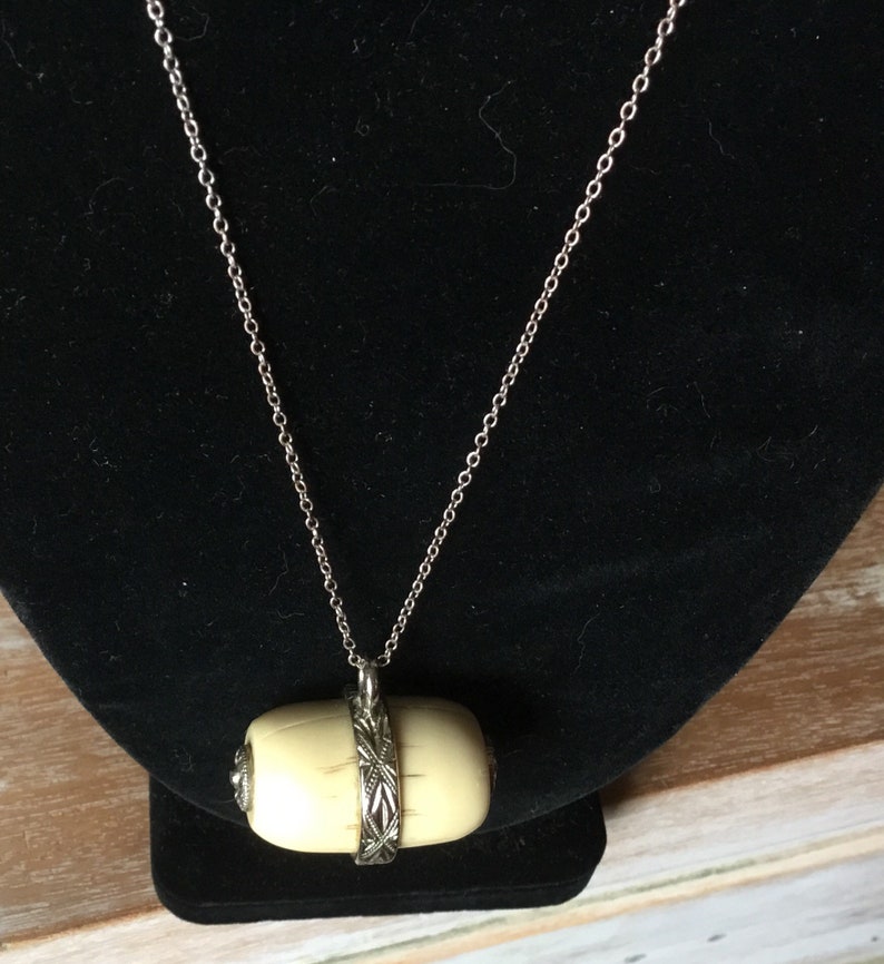 Asian bone pendant necklace.